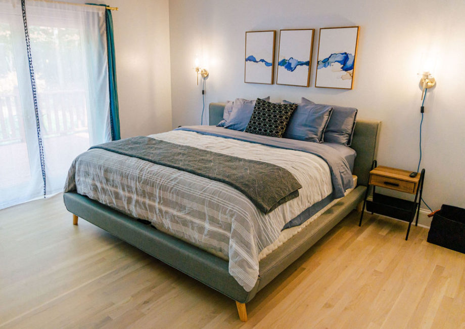 Retreat to the master bedroom with it's comfortable King Sized bed with firm mattress, organic sheets, and ample pillows. 55" Roku Smart TV, and French doors onto the wrap-around porch.