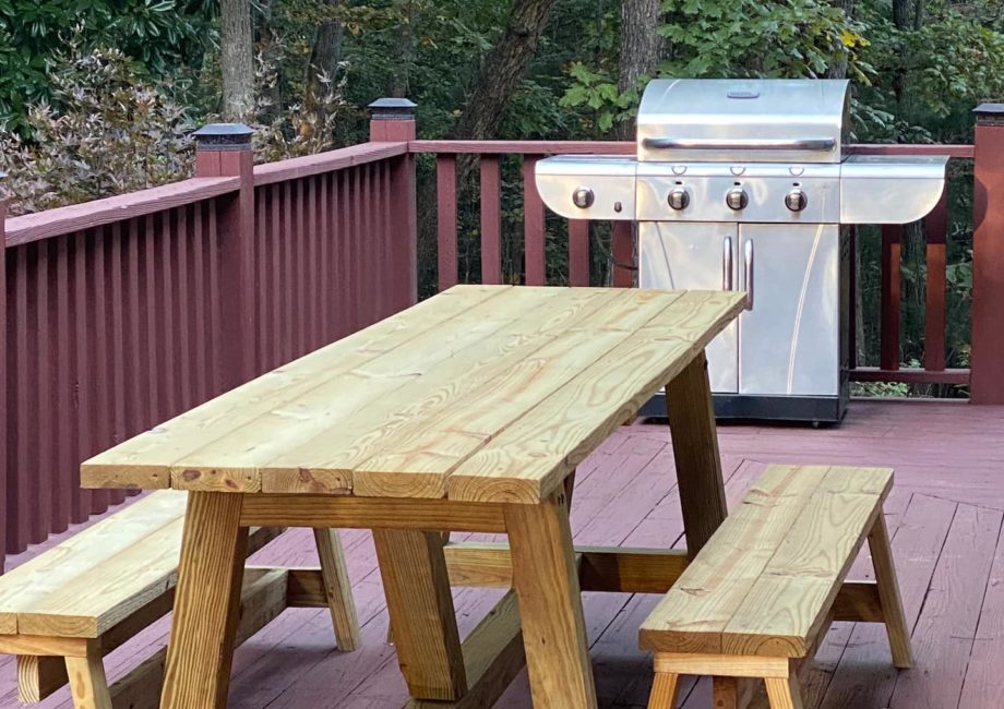 10’ custom outdoor patio table with 4 burner stainless steel BBQ gas grill.